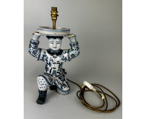 A CHINESE BLUE AND WHITE TABLE LAMP IN THE FORM OF A BOY, 32cm H 