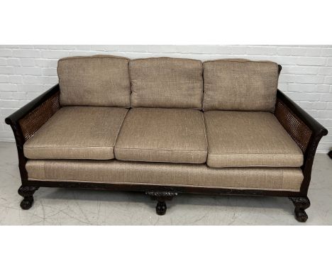 A BERGERE SOFA WITH CANED BACK AND SIDES, OATMEAL UPHOLSTERED SEAT AND CUSHIONS,185cm x 80cm x 80cm  Purchased by the vendor 