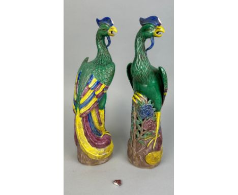 A PAIR OF CHINESE KANGXI STYLE PHOENIXES, 30cm H each. Each with broken crests (one present) 