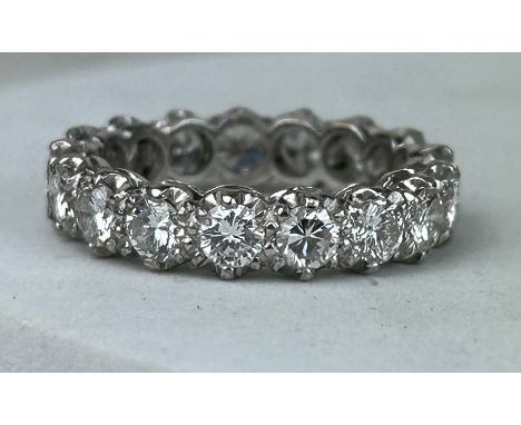 AN 18CT WHITE GOLD ETERNITY RING SET WITH DIAMONDS CIRCA 1930'S, 17mm UK size N 4.5gms