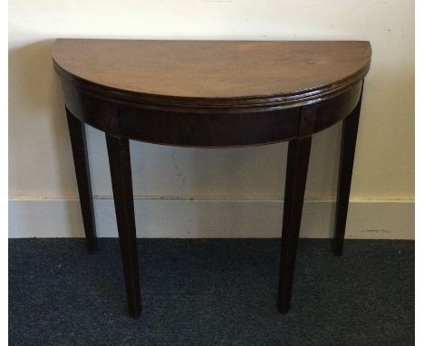 A good Georgian mahogany bow front card table on tapering supports. Est. £60 - £80.