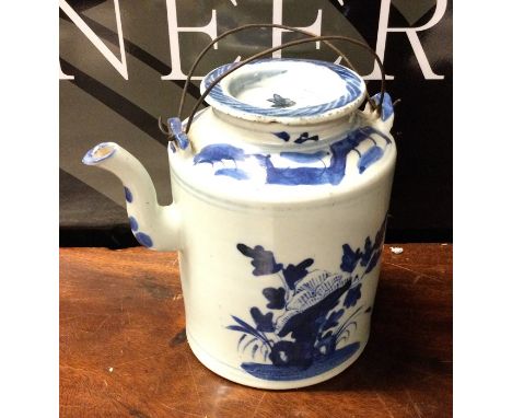 A large cylindrical Chinese teapot with lift-off cover. Approx. 17 cms high. Est. £30 - £50.