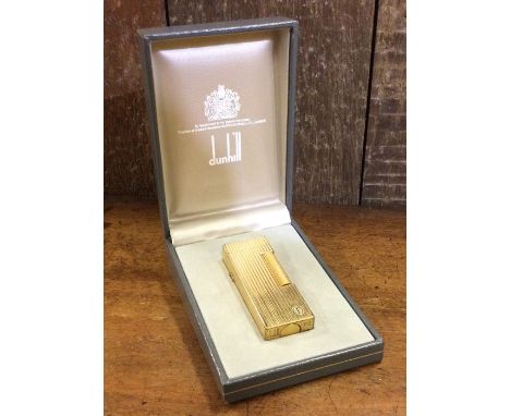 DUNHILL: A cased gold plated lighter. Est. £20 - £30.