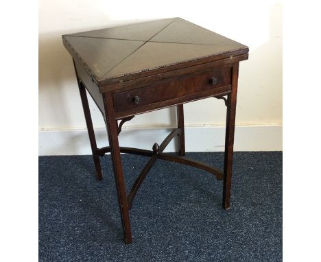 An Edwardian mahogany envelope card table. Est. £30 - £50.