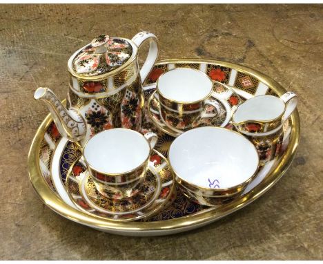 ROYAL CROWN DERBY: An attractive miniature dolls' tea service on tray with gilded decoration. Approx. 19.5 cms across. Patter