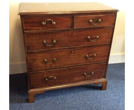 A Georgian mahogany chest of five drawers on bracket feet. Est. £60 - £80.