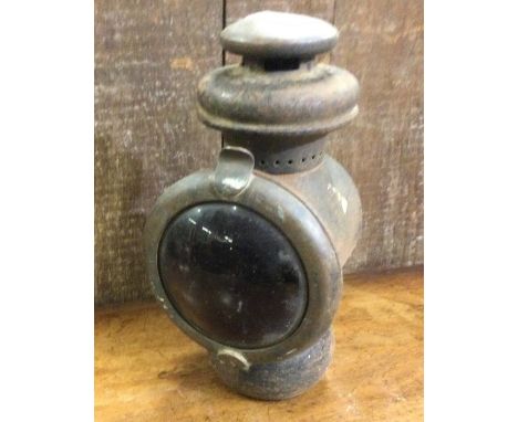 An old railwayman's lamp. Est. £20 - £30.