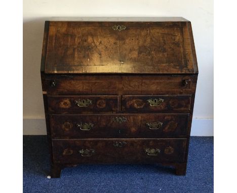 An early George II figured walnut bureau on bracket feet to fitted interior. Est. £80 - £120.