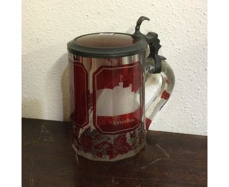 An attractive German ruby glass and pewter tankard etched with mountainous views. Est. £30 - £50.