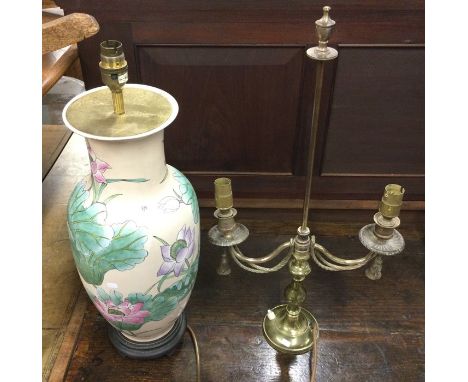 A tall pottery floral decorated vase converted to a lamp together with a brass candelabra converted to a lamp. Est. £20 - £30