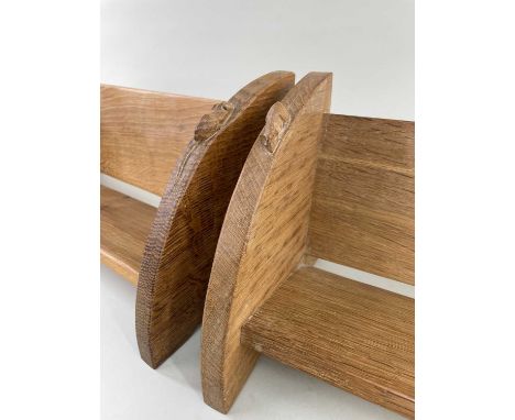 PAIR ROBERT 'MOUSEMAN' THOMPSON OAK BOOK TROUGHS, of simple boarded construction, the quadrant sides carved in relief with si