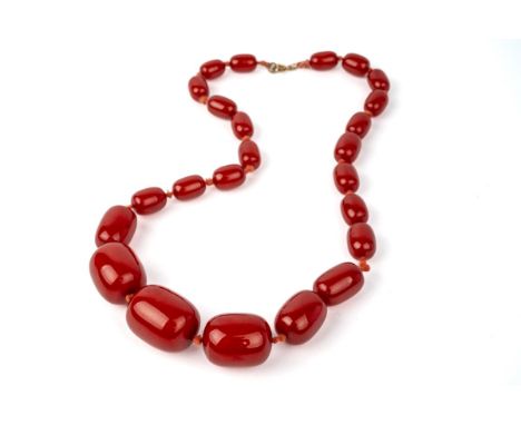 A cherry amber bead necklace, gross weight approx 60g, largest bed measures approx. 27mm x 20mm, grain visible under bright l