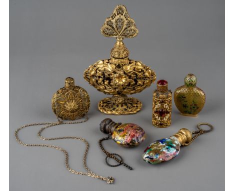 A collection of gilt metal mounted scent and snuff bottles, including a Chinese snuff bottle with fish-scale cloisonné enamel