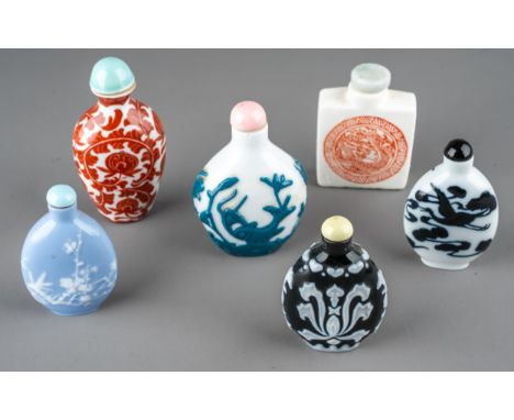A collection of Chinese snuff bottles, including moulded cameo glass in monochrome and polychrome; together with a ceramic sq