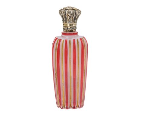 A 19th century milch glass scent bottle, with ruby flash and gilt stripes, silver hinged cover, approx 9.5cm long  Generally 