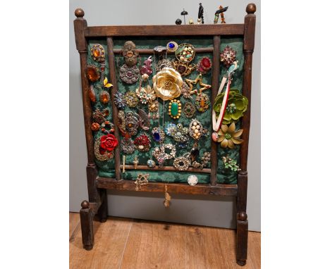A collection of brooches and hat pins, including a David Anderson silver and enamel golden leaf brooch; butterly brooches; ca