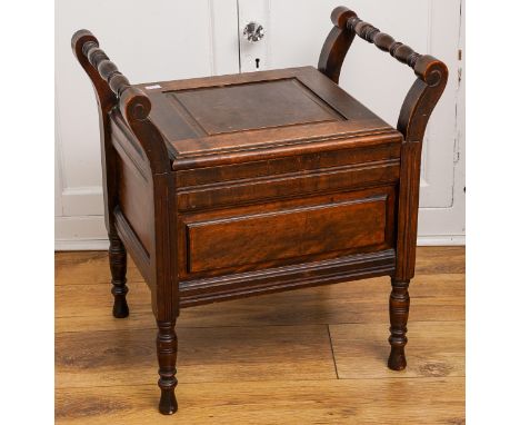 A 19th Century mahogany commode, hinged cover opens to reveal ceramic pot, with turned handles and supports, 58cm at highest 