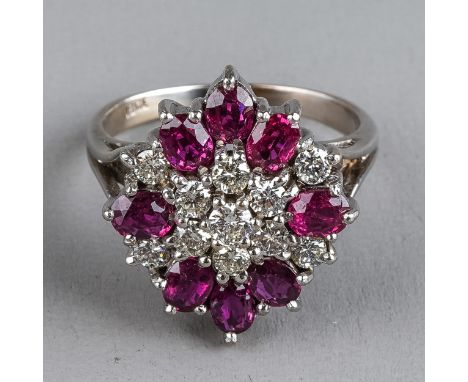 An 18ct white gold diamond and ruby cluster ring, set with eleven round brilliant-cut diamonds and eight oval-cut rubies, tot
