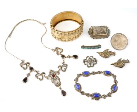 A collection of silver jewellery including a Victorian silver gilt hinged bangle, two Aesthetic movement brooches, a pair of 