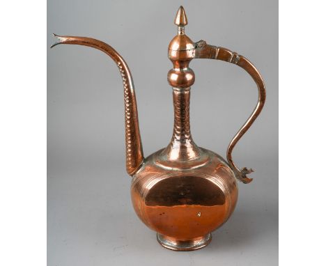 A Middle Eastern large copper water pitcher and cover, approx 36cm high  