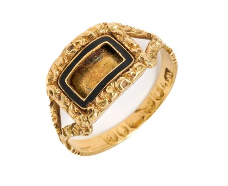 A George III 18ct gold and enamel memorial ring, the central cartouche with black enamel border, foliate engraved head and sh