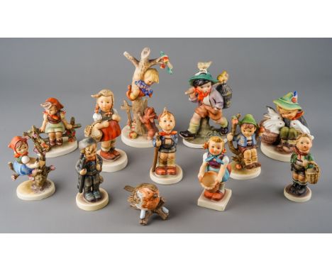 Twelve various German figures of children and a robin, eleven Hummel and one by Friedal (12)  