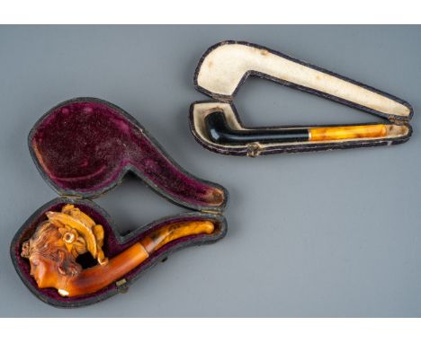 A late 19th/early 20th century Meerschaum pipe, carved as a profile of a lady wearing a bonnet, amber mouth-piece, approx 10c