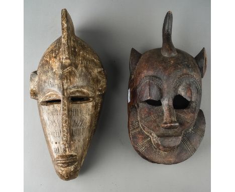 Two antique African tribal masks, the first approx 28cm tall x 14cm wide, the second approx 30cm tall x 15.5cm wide (2)  