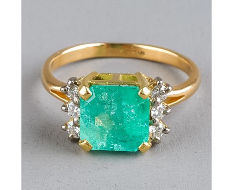 An 18ct yellow gold emerald and diamond ring, set with a square-cut emerald approx 8.38mm x 8.31mm x 6.13mm, flanked by six r