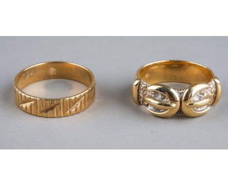 A 9ct yellow gold buckle ring, size N1/2, approx 5.4g; and another 9ct yellow gold ring (split), approx 2.4g (2)  buckle ring