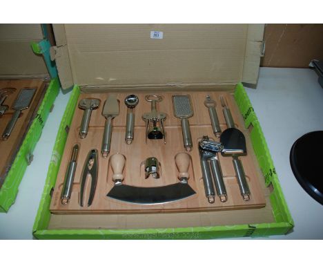 A Kitchen Tool set with beech wood base board (13 tools).