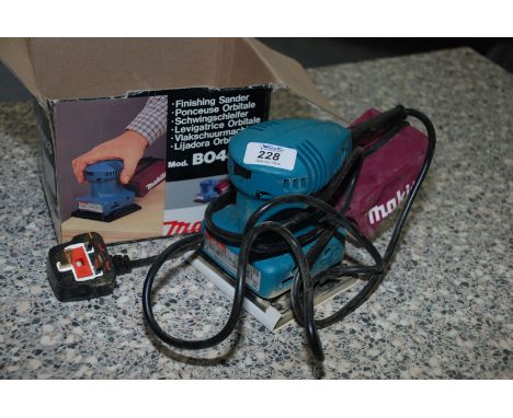 A boxed "Makita BO4553", 240 volt Finishing Sander with dust collector.