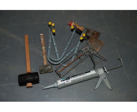 Two rubber hammers, ladder brackets, two skeleton guns and two paint scrapers.