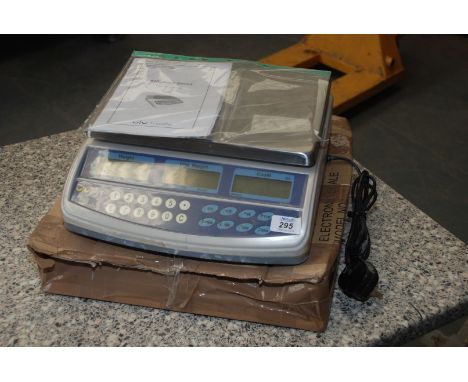 An Electric Scales with print-out, weighs up to 6 kg.
