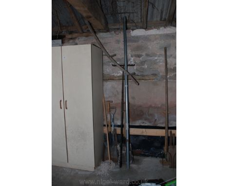 A quantity of Garden Tools including a Scythe, shovels, a long load-retaining Bar, a rake and a mop.   (No VAT on this Lot)