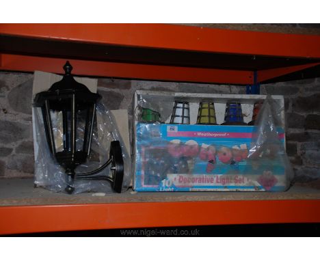 An outside Lantern light and weatherproof Party Lights.   (No VAT on this Lot)