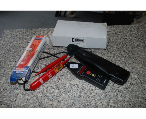 A "Draper Expert" Voltage Continuity Tester and a cased Compact Optical Tachometer.
