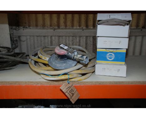 A pneumatic Random Orbital Sander, air pipe and abrasive discs.