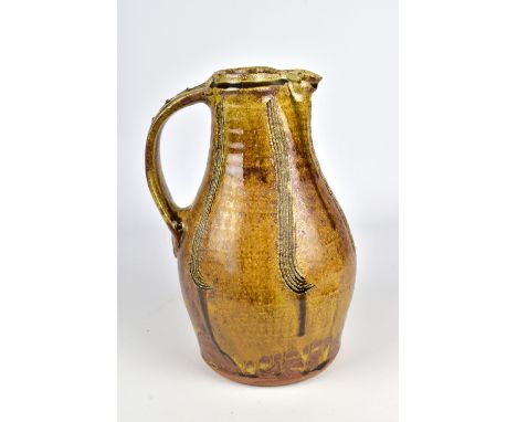 JIM MALONE (born 1946); a stoneware baluster jug covered in ash and iron glaze with combed decoration, impressed JM and L (fo