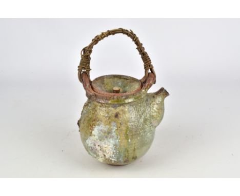 AKIKO HIRAI (born 1970); a stoneware teapot with willow handle and textured surface, incised mark, height 13.5cm (excluding h