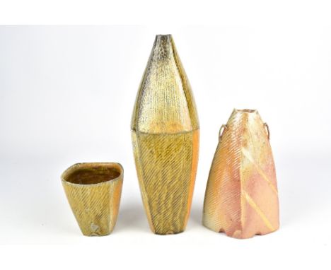 BILL WILKEY; a tall stoneware bottle with patchwork decoration, a lugged vase and a cup, incised signatures and dated 2012 an