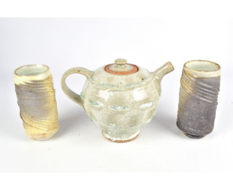 STEPHEN PARRY (born 1950); a wood fired stoneware teapot and two tumblers, impressed SP marks, tallest 16cm (3). (D)Provenanc