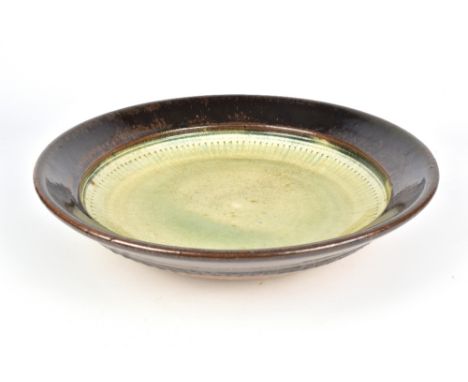 RICHARD BATTERHAM (born 1936); a stoneware charger with roulette pattern below the rim, diameter 36cm. (D)Provenance: Purchas