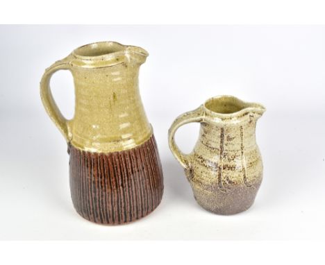 JIM MALONE (born 1946); a stoneware jug covered in ash and tenmoku breaking to kaki glaze and a small salt glazed baluster ju