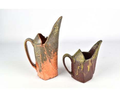 BEDE CLARKE; a square wood fired stoneware pitcher with tall spout and a matching smaller pitcher, impressed marks, tallest 2