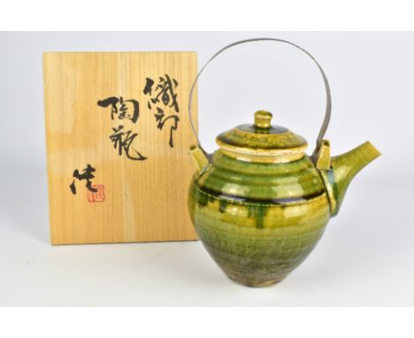 KEN MATSUZAKI (born 1950); an oribe stoneware teapot with metal handle, height 18cm (excluding handle), with signed box.Prove
