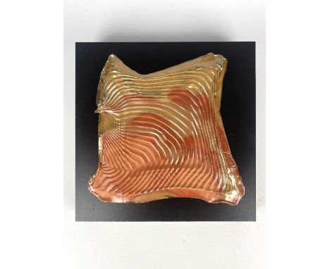 CONNIE CHRISTENSEN; a fluted wood fired porcelain tile, painted signature, 25.5 x 24.5cm, mounted on board.Provenance: Purcha
