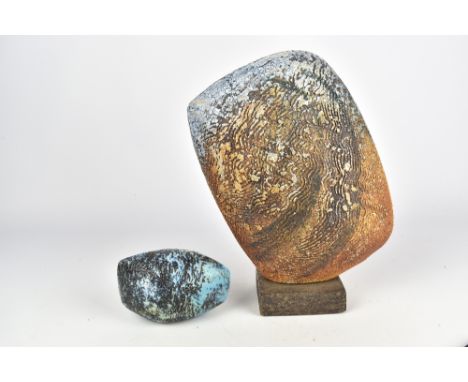 ALAN FOXLEY (born 1933); a stoneware sculptural form with textured surface on a square base and a small pebble sculpture, imp