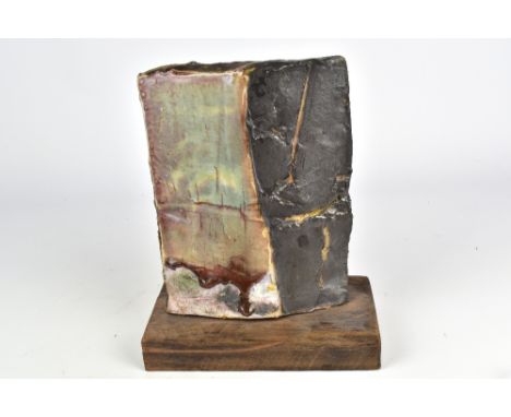EDDIE CURTIS (born 1953); a rectangular stoneware sculpture on a wooden base with celadon and running copper red glaze, heigh