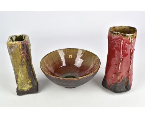 MARGARET CURTIS (born 1955); a faceted stoneware vase covered in copper red glaze, a square vase and a bowl, impressed MC mar